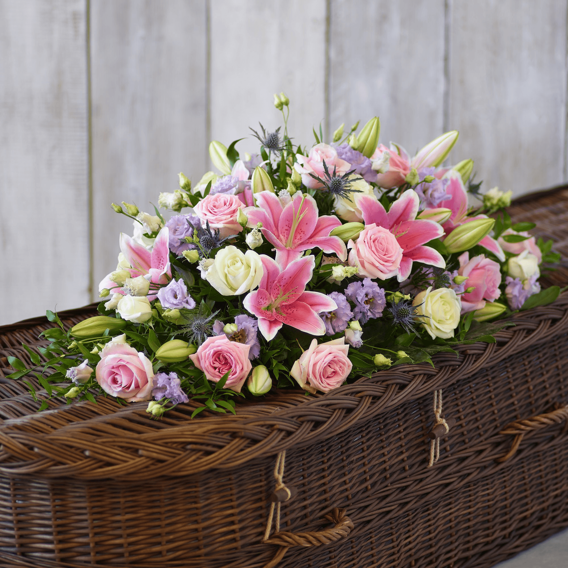 Rose and Eryngium Casket Spray — Funeral hand-tied bouquet
